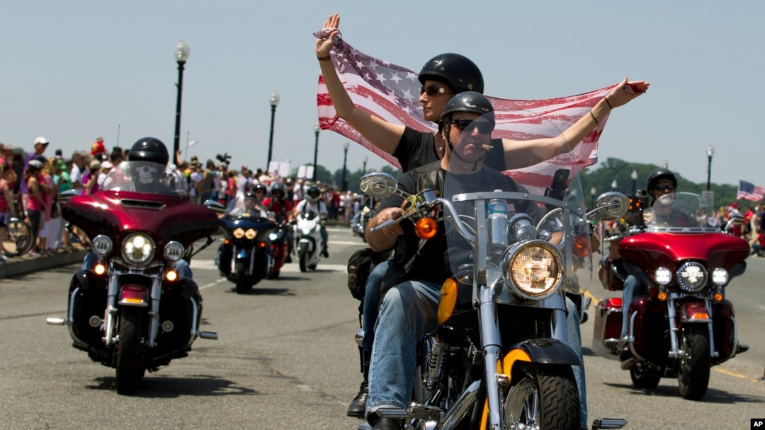 FILE - Participants in the annual Rolling Thunder motorcycle rally ride past Arlington Memorial Bridge during the parade ahead of Memorial Day in Washington, May 24, 2015.