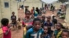 FILE - Children of around 6,000 ethnic Fulanis who have been displaced by attacks, gather in a makeshift camp for the displaced in Youba in Yatenga province in Burkina Faso, April 20, 2020.