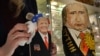 An employee polishes traditional Russian wooden nesting dolls depicting Donald Trump (L), U.S. president-elect at the time, and Russian President Vladimir Putin at a gift shop in central Moscow, Russia, Jan. 16, 2017.