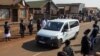 Healthcare workers and members of the community form an honor guard to mark the service and commitment of their colleague, Duduzile Margaret Mbonane, who died from COVID-19, during her funeral in Thokoza east of Johannesburg, South Africa, July 23, 2020.