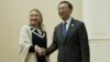 U.S. Secretary of State Hillary Rodham Clinton, left, and Chinese Foreign Minister Yang Jiechi pose for photos before their meeting on the sideline of the ASEAN regional forum in Phnom Penh, July 12, 2012.