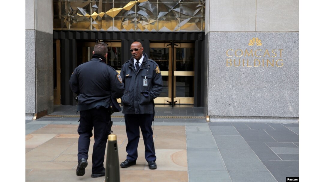 Police and security stand outside 30 Rockefeller Plaza, the location for the offices of U.S. President Donald Tump's lawyer Michael Cohen which was raided by the FBI today in the Manhattan borough of New York City, New York, April 9, 2018.