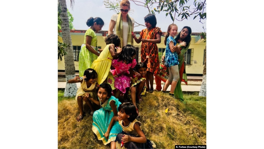 Mother and daughter Sasha and Maya Forbes teach English while playing with Bangladeshi girls in Khulna, Bangladesh, April 2018. The girls are part of the Alingon Home, a safe place for more than 20 girls who have been removed from brothels.