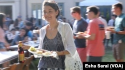 International students from around the world -- like Arina Zaytseva, a Ph.D. candidate in religious studies from Russia -- are starting schools at colleges and universities around the U.S. To help them understand insurance requirements and visa specifications, schools like Rice University in Houston, Texas, bring them together for food and drink, too.