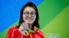 Fu Yuanhui of China poses with her medal, August 8, 2016.