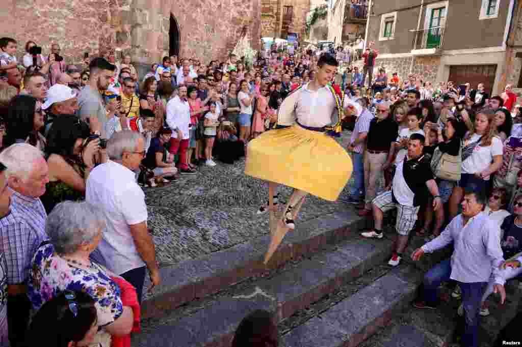 A dancer performs the whirling Dance of the Zancos on Saint Mary Magdalene's feast day in Anguiano, Spain.