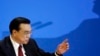China's Premier Li Keqiang gestures at the end of a news conference following the closing ceremony of China's National People's Congress (NPC) at the Great Hall of the People in Beijing, China, March 16, 2016. 