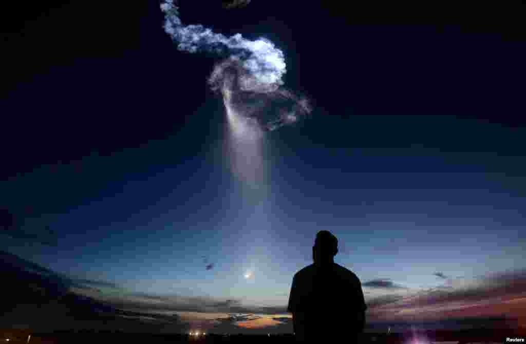 A SpaceX Falcon 9 rocket exits the atmosphere for a cargo resupply mission to the International Space Station, over Cape Canaveral, Florida, U.S.