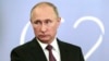 FILE- Russian President Vladimir Putin speaks to the media after the G-20 summit in Buenos Aires, Argentina, Dec. 1, 2018.