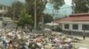 Bodies from the Haitian earthquake can be seen on the side of the road in Port-au-Prince