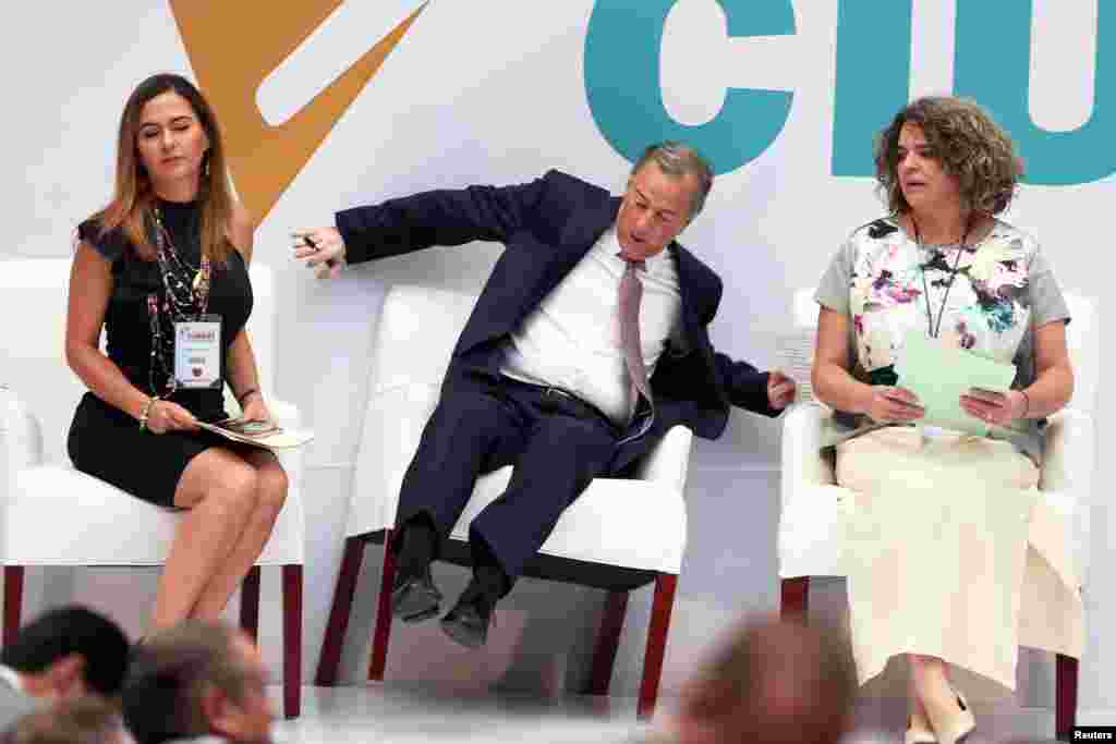 Institutional Revolutionary Party (PRI) presidential candidate Jose Antonio Meade reacts while falling off his chair after arriving to a meeting with citizens in Mexico City, Mexico, May 29, 2018.