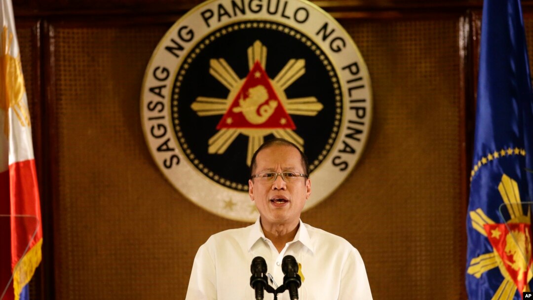 FILE - Philippine President Benigno Aquino III addresses the nation in a live broadcast from the Presidential Palace in Manila, July 14, 2014. 