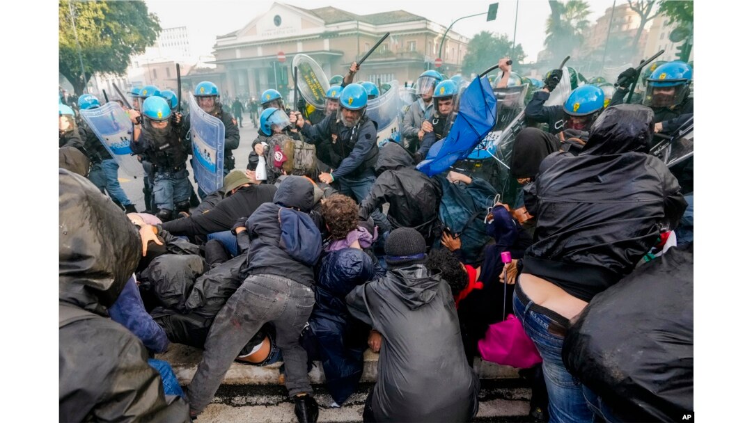 Italian Police and demonstrators clash during a march in support of the Palestinian people in Rome, Oct. 5, 2024, two days before the anniversary of Hamas-led groups' attack in Israeli territory outside of Gaza on Oct. 7, 2023.