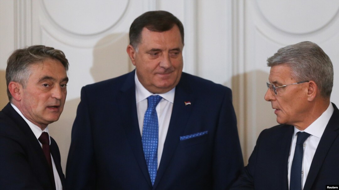 Newly elected members of Bosnia's tripartite inter-ethnic presidency, Croat member Zeljko Komsic, Serb member Milorad Dodik and Bosniak member Sefik Dzaferovic, attend the presidential inauguration ceremony in Sarajevo, Nov. 20, 2018.