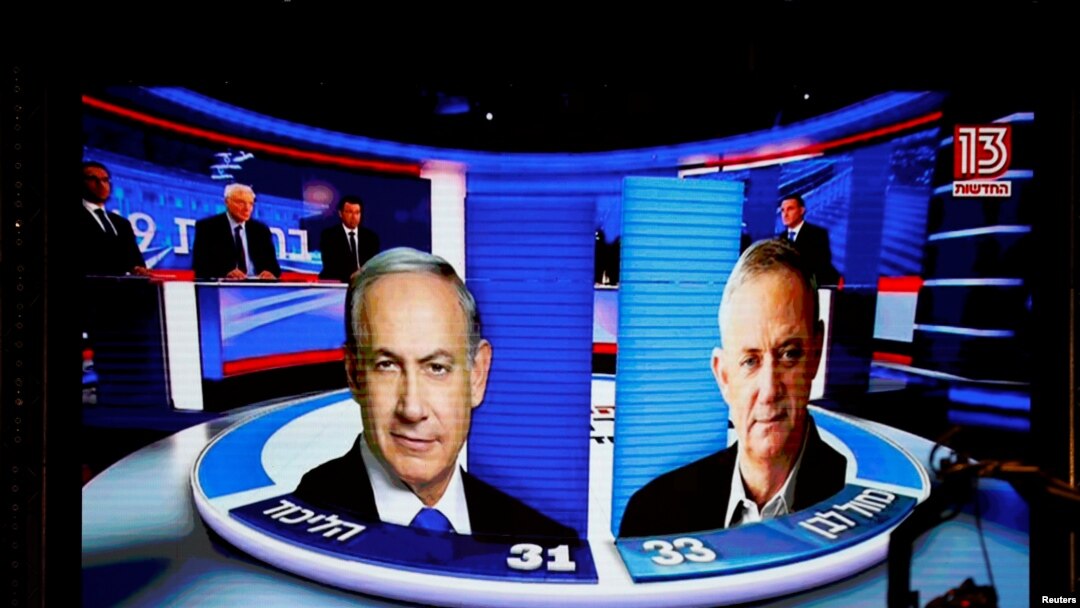 The results of the exit polls are shown on a screen at Benny Gantz's Blue and White party headquarters, following Israel's parliamentary election, in Tel Aviv, Israel, Sept. 17, 2019. 