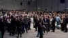 People gather during a stocktaking plenary session at the COP26 U.N. Climate Summit in Glasgow, Scotland, Britain, Nov. 13, 2021. Going into overtime, negotiators at the talks are still trying to find common ground on phasing out coal.