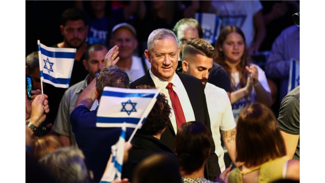 Blue and White party leader Benny Gantz gets surrounded by his supporters as he arrives to election campaign in Tel Aviv, Israel, Sept. 15, 2019.