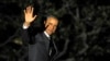 President Barack Obama waves as he walks to Marine One on the South Lawn of the White House in Washington, March 19, 2013. 
