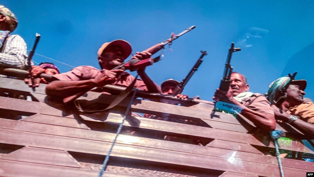A picture taken from a car shows Ethiopian Amhara militia soldiers, that fight alongside federal and regional forces against the northern region of Tigray, in the city of Gondar, Ethiopia, on Nov. 9, 2020.
