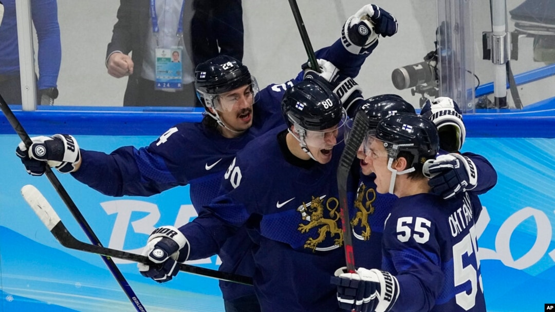 Finland celebrates a goal by Ville Pokka during the men's gold medal hockey game against the Russian Olympic Committee at the 2022 Winter Olympics, Feb. 20, 2022, in Beijing. 