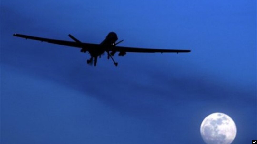 A U.S. Predator drone flies over the moon above Kandahar Air Field, southern Afghanistan (File Photo)