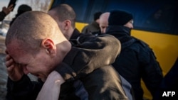 Колишні військовополонені українці після обміну 31 січня 2024 року.