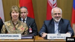 عکس آرشیوی از محمدجواد ظریف وزیر خارجه ایران (راست) و کاترین اشتون مسئول سیاست خارجی اتحادیه اروپا - ۲۴ اردیبهشت ۱۳۹۳ 