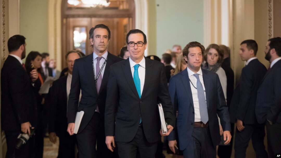 Treasury Secretary Steven Mnuchin arrives at the Capitol for a closed-door meeting with Senate Majority Leader Mitch McConnell, R-Ky, as they struggle to get a tax code overhaul, in Washington, Sept. 12, 2017.