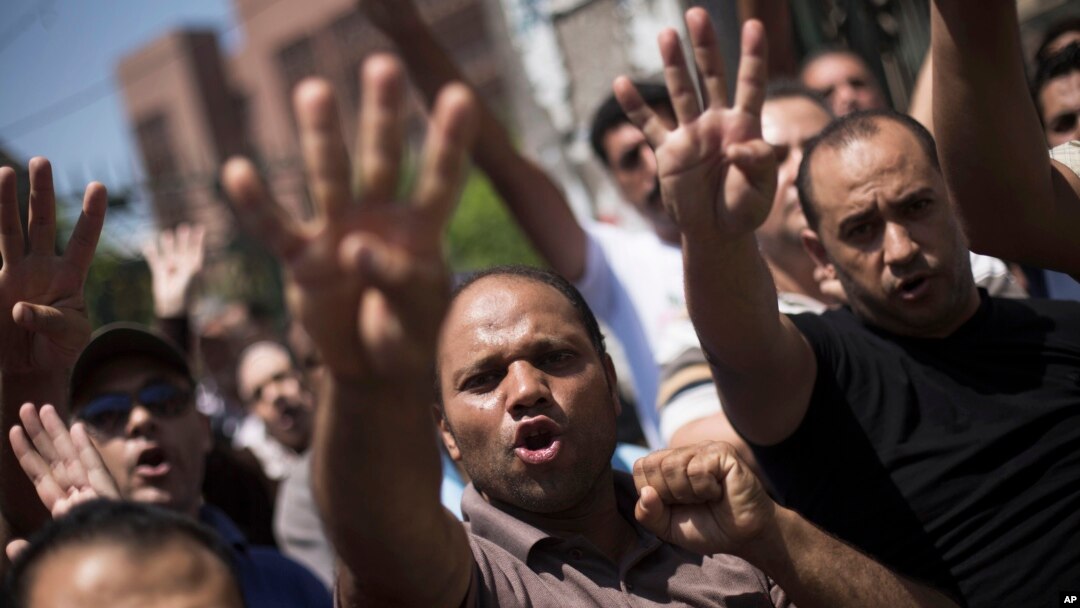 Supporters of Egypt's ousted President Mohammed Morsi chant slogans against the Egyptian Army during a march near Al Nour mosque in Abassia district in Cairo, Egypt, Aug. 23, 2013. 