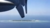 FILE - In this March 23, 2016, file photo, an aerial view is seen from a military plane carrying international journalists of the Taiwan-controlled Taiping island, also known as Itu Aba, in the Spratly archipelago, roughly 1600 kms. (1000 miles) in the So