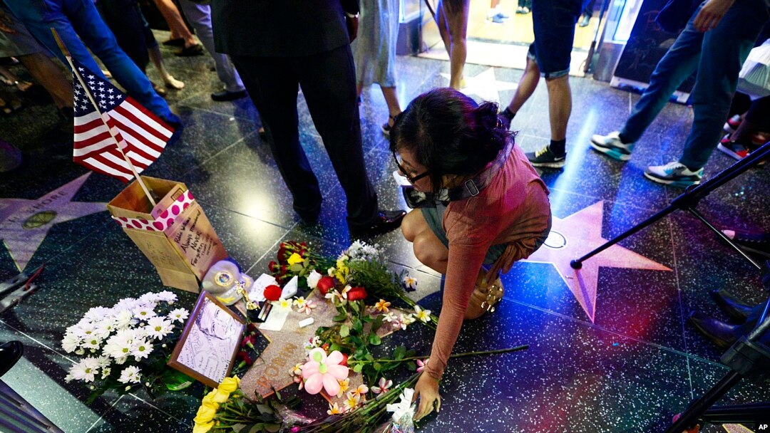 Flowers are placed in memory of actor and comedian Robin Williams on his Walk of Fame star in Hollywood, Monday, Aug. 11, 2014. 