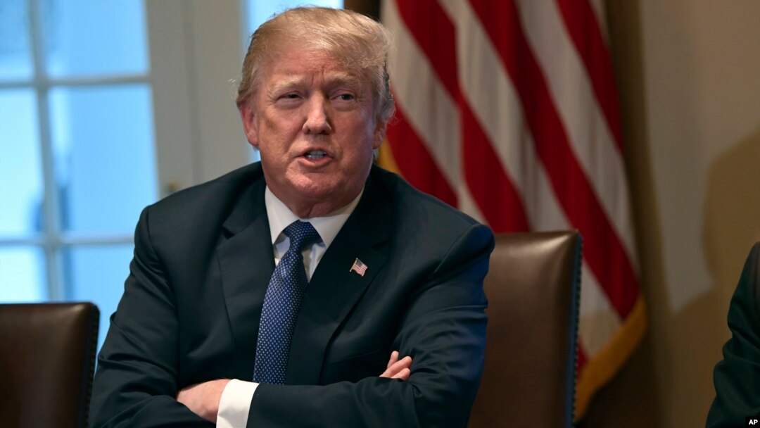 President Donald Trump speaks in the Cabinet Room of the White House in Washington, April 9, 2018, at the start of a meeting with military leaders. 