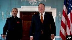Secretary of State Mike Pompeo and Indian External Affairs Minister Dr. S. Jaishankar walk to meet the media before a bilateral meeting at the Department of State in Washington, Dec.18, 2019. 