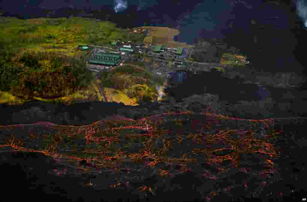 Lava from the Kilauea volcano flows near the Puna Geothermal Venture power plant in Pahoa, Hawaii, June 10, 2018.