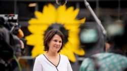 FILE - Germany's Green party leader Annalena Baerbock gives an interview before her party's federal delegates conference, in Berlin, Germany, June 10, 2021.