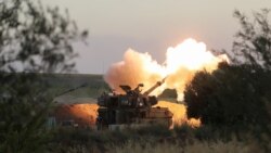 以色列炮兵在以色列与加沙地带边界附近开火。(2021年5月19日)