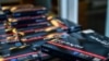 Employees of the Miami-Dade Public Library System distribute COVID-19 home rapid test kits in Miami, Florida, on Jan. 8, 2022