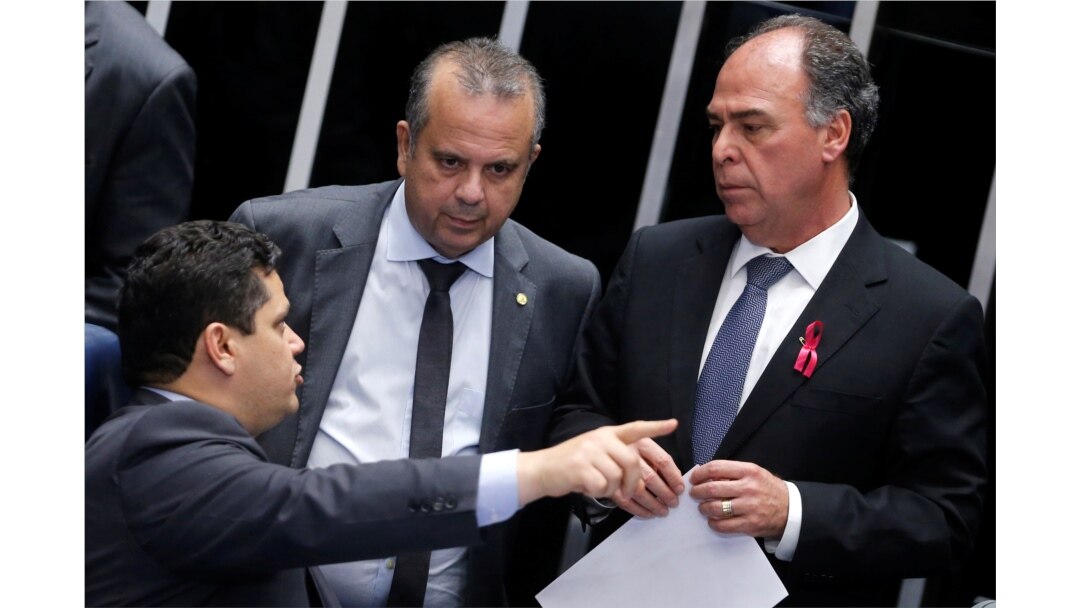 Brazil's President of the Senate Davi Alcolumbre speaks with Secretary of Social Security Rogerio Marinho and Senator Fernando Bezerra during a session to vote on a pension reform bill at the Federal Senate in Brasilia, Oct. 1, 2019.