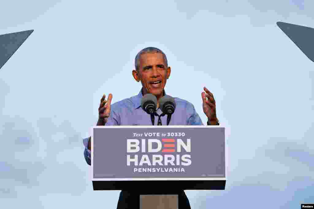 Former U.S. President Barack Obama gestures as he campaigns on behalf of Democratic presidential nominee and his former Vice President Joe Biden in Philadelphia, Pennsylvania, Oct. 21, 2020.
