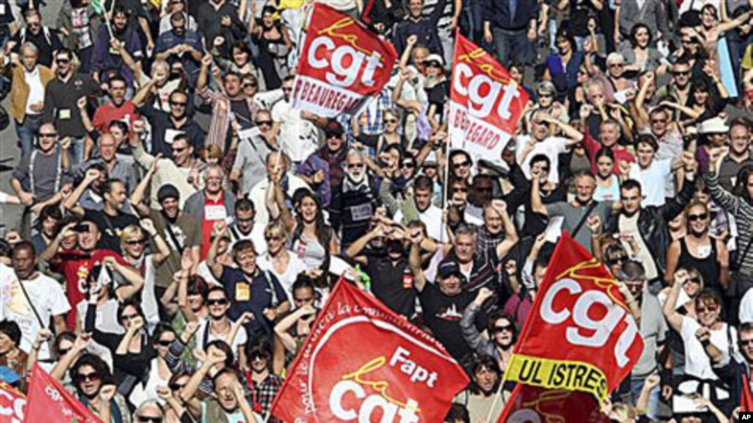 Followers of the CGT Union (General Confederation of Work) attend a protest march in Marseille, southern France, over the government's attempt to raise the retirement age by two years to save money, 12 Oct 2010