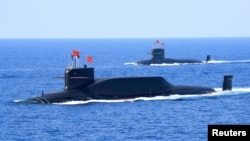 资料照：中国海军094A晋级弹道导弹战略核潜艇在南中国海参加军事表演。（2018年4月12日）