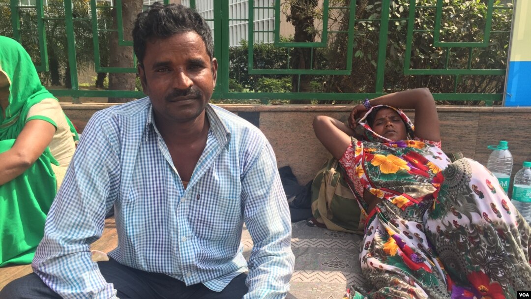 Shavan Kumar has travelled to New Delhi with his wife from his village to get her treated for a heart condition at a government hospital, where treatment is free. (A. Pasricha/VOA)