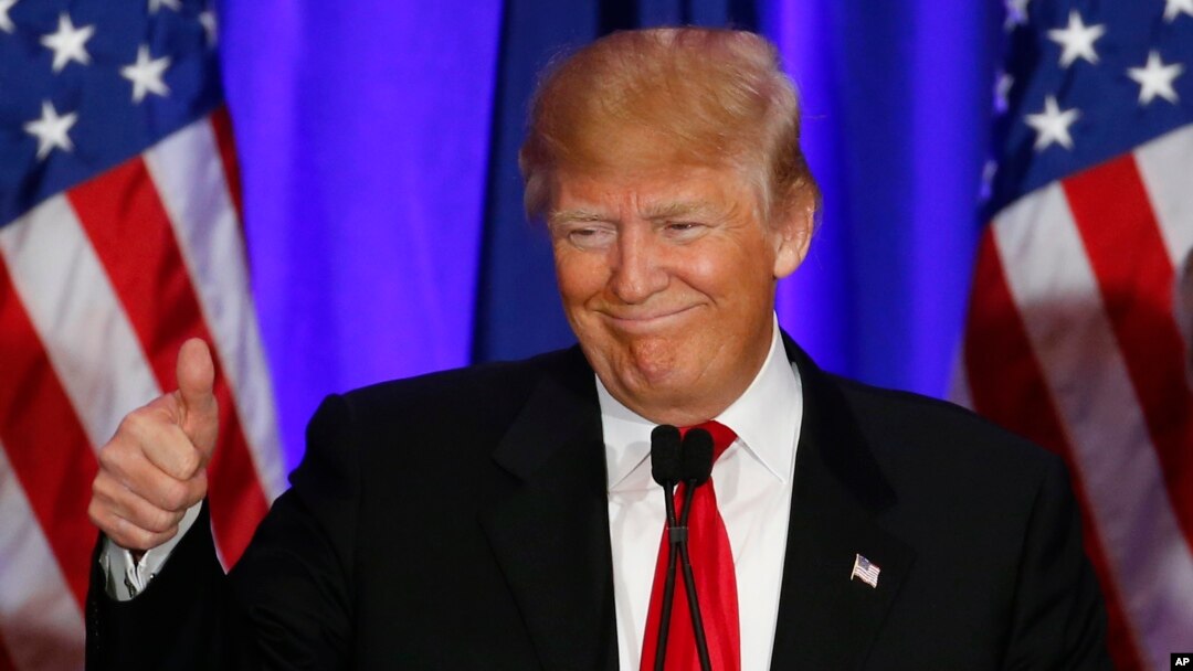 Republican presidential candidate Donald Trump gives a thumbs up during a South Carolina Republican primary night event in Spartanburg, S.C., Feb. 20, 2016. 