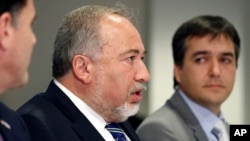 Israeli Defense Minister Avigdor Lieberman, center, speaks during a meeting with Defense Secretary Jim Mattis at the Pentagon, Oct. 19, 2017, in Washington.