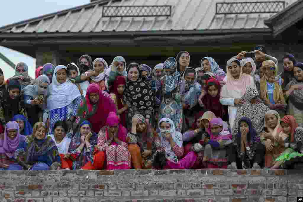 Kashmiri women react as they follow the funeral of Dawood Salafi, a local rebel commander, on the outskirts of Srinagar, Indian controlled Kashmir. At least four rebels, a counterinsurgency police official and a civilian were killed during a gunbattle in disputed Kashmir on Friday, triggering anti-India protests and clashes in which several people were injured. 
