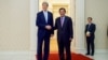U.S. Secretary of State John Kerry poses for photographers with Cambodian Prime Minister Hun Sen before a bilateral meeting on Jan. 26, 2016, at the Peace Palace in Phnom Penh, Cambodia.