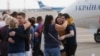 Relatives of Ukrainian prisoners freed by Russia greet them upon their arrival at Boryspil airport, outside Kyiv, Ukraine, Sept. 7, 2019. 