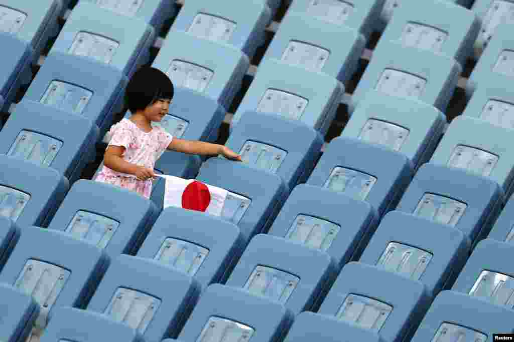 A child is seen in the stands during women's soccer as New Zealand takes on Sweden in the Tokyo 2020 Olympics at Miyagi Stadium, Miyagi, Japan.