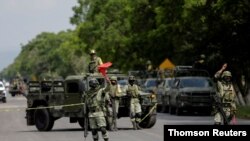Members of the National Guard are seen at a military check point after Mexican security forces captured Jose Antonio Yepez known as "El Marro" (The Mallet) in Santa Cruz de Juventino Rosas, Aug. 2, 2020.