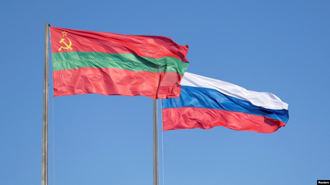 FILE - Flags of Transdniestria and Russia fly in a square in Tiraspol, Moldova's breakaway region of Transdniestria, Jan. 4, 2025.